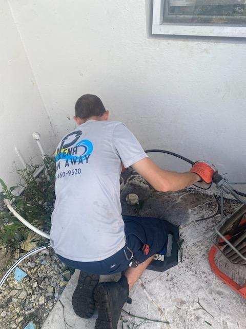 Peña Drain Away plumber working on a residential plumbing repair